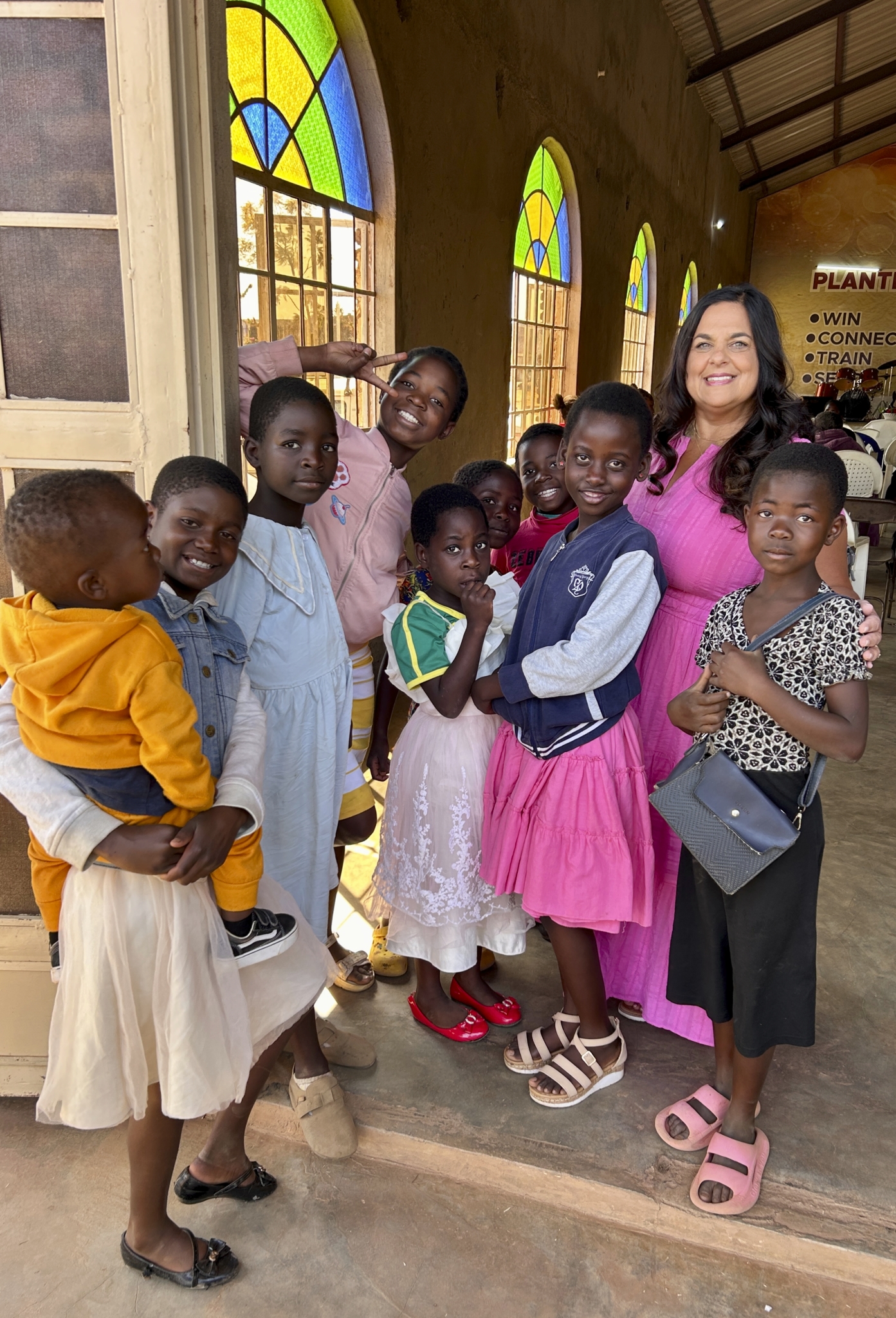 Monica serving children during a Living Stones mission in Malawi