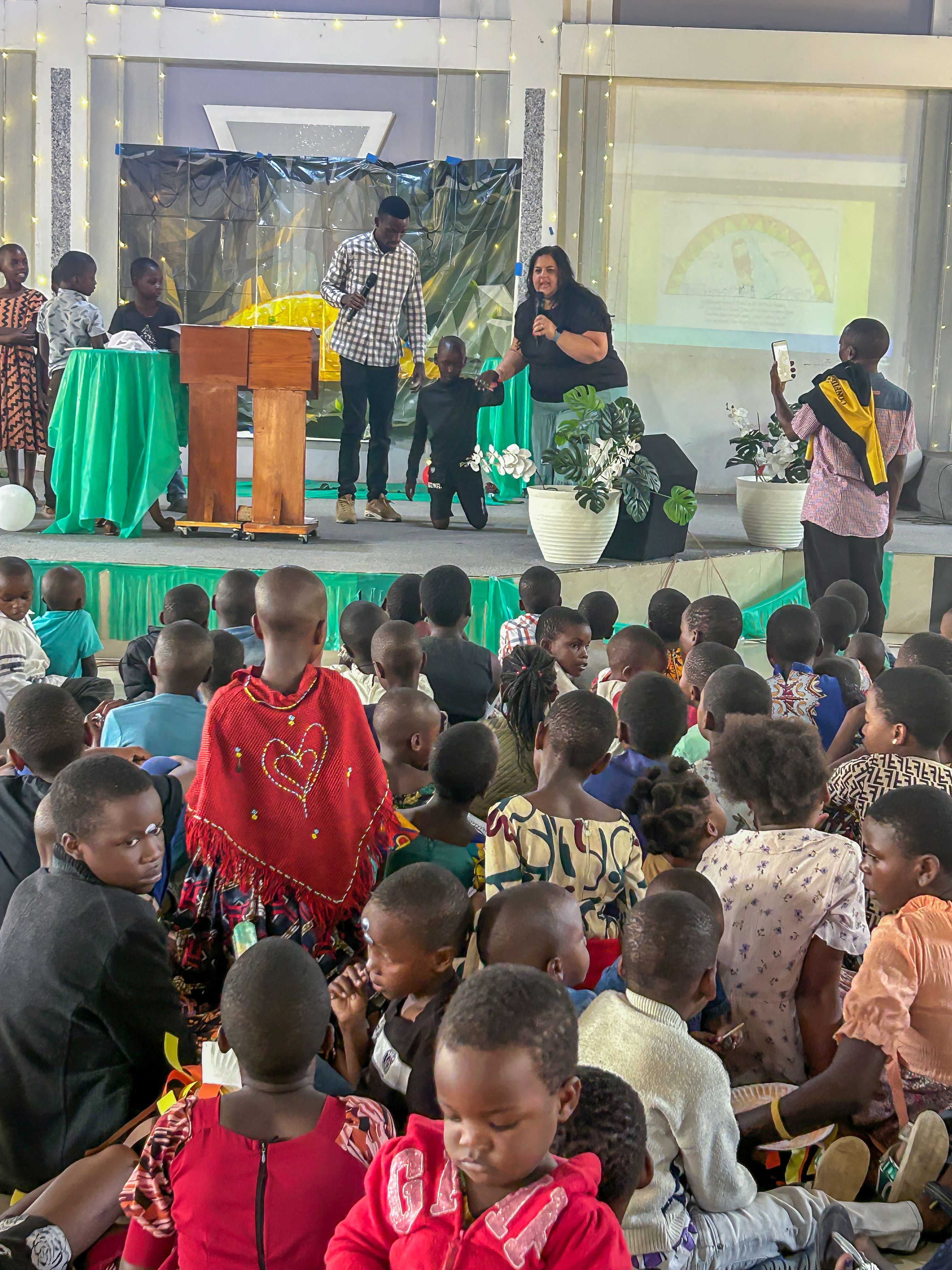 Monica teaching a large group of children during VBS in Tanzania